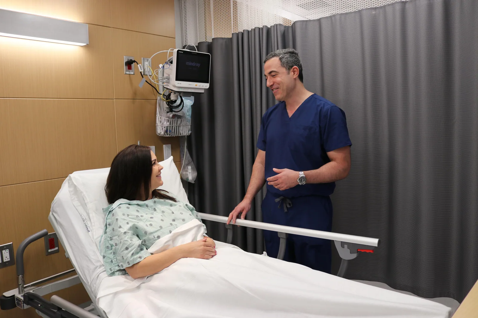 Dr. Yasmeh explaining a spine condition to a patient